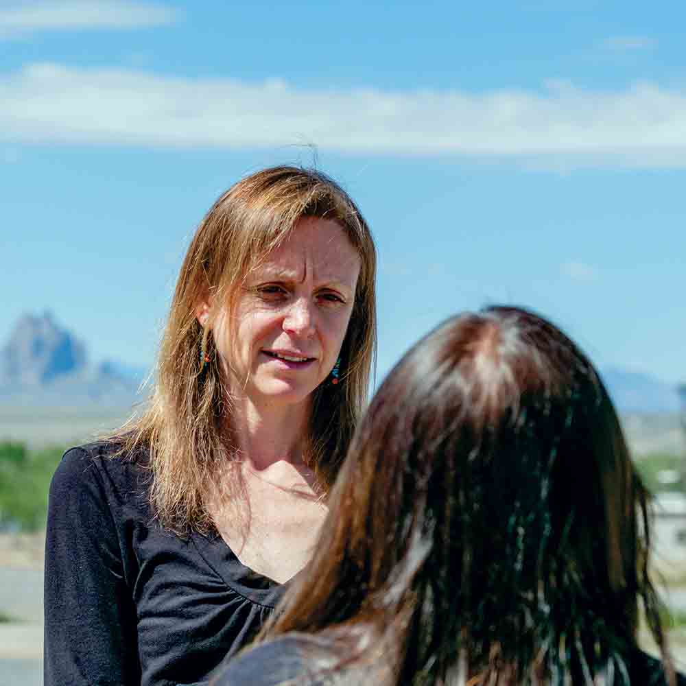 DNA People's Legal Services Attorney Heather Hoechst talks with a client in Shiprock, New Mexico.